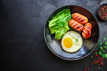 healthy breakfast, fried eggs sausages and vegetables Menu concept. food background. top view copy space for text keto or paleo diets
