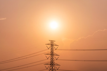 High voltage pole, Transmission tower with power line at sunset