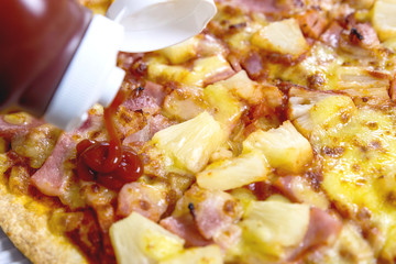 Sliced Hawaiian pizza.