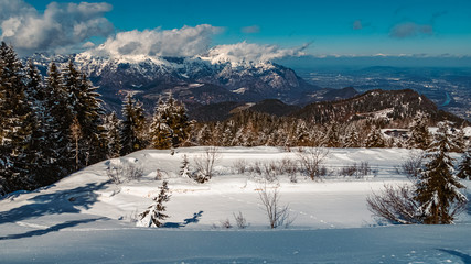 Beautiful winter landscape at the famous Rossfeldstrasse near Berchtesgaden, Bavaria, Germany with the Untersberg and Salzburg in the background