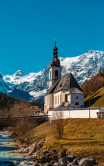 The famous church Saint Sebastian at Ramsau, Berchtesgaden, Bavaria, Germany on a sunny morning with the snow-covered alps in the baclground © Martin Erdniss