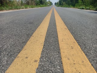 Obraz premium Asphalt roads in Thailand and yellow traffic lines