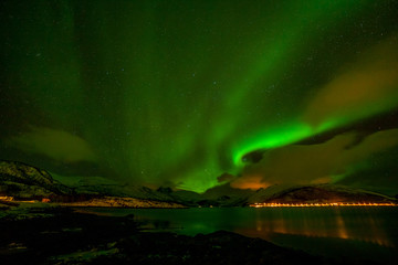 Fototapeta na wymiar Dramatic polar lights, Aurora borealis over the mountains in the North of Europe - Lofoten islands, Norway