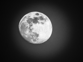 Edited version of the full moon with black sky in the background.