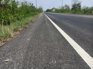 Asphalt road in Thailand and white traffic line
