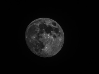 Edited version of the full moon with black sky in the background.