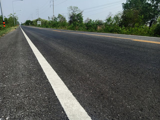 Fototapeta premium Asphalt road in Thailand and white traffic line