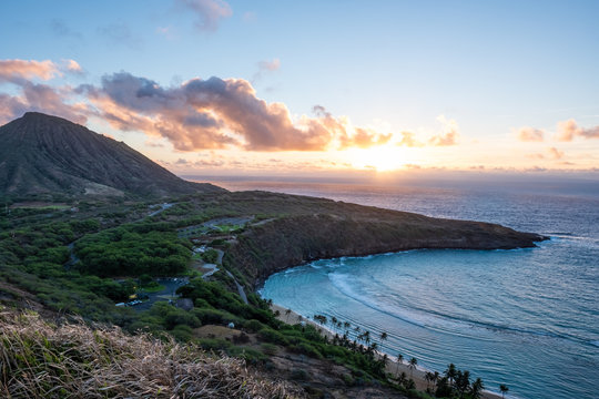 Hanama Bay sunrise - orange - golden hour - over pacific ocean