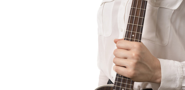 Fret Board Of A Ukulele In Female Hand, Isolated On White