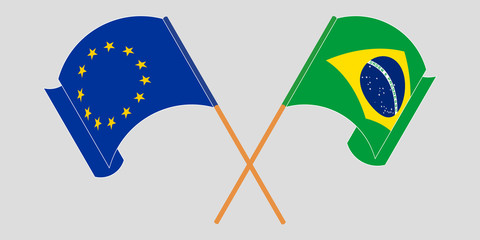 Crossed and waving flags of Brazil and the EU