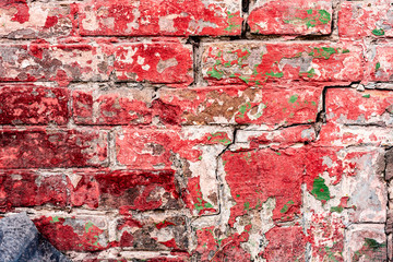 Texture of a brick wall with cracks and scratches which can be used as a background