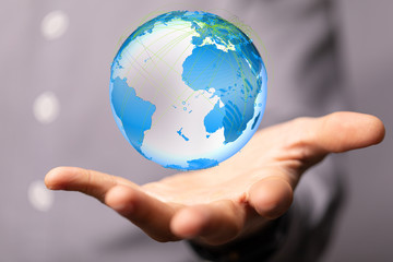 Human Hand Holding The World In Hands.