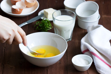 Ingredients and accessories for making omelet. Rustic style.