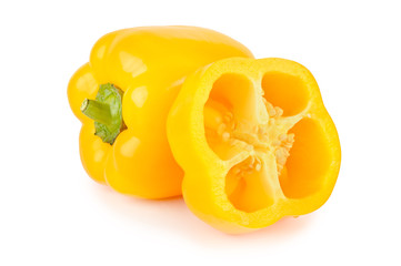 Whole yellow bell peppers and half