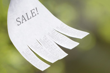 White sale banner of goods or services. Blank advertisement with cut slips.
