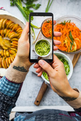 Phone food photography. Smartphone photo of vegetables lunch. Make a picture for social media blogging or online service order concept of vegan meal.