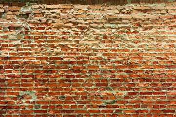 Surface of wall made with crushed red bricks