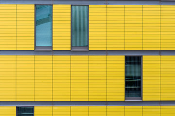 Fototapeta premium Closeup of modern yellow facade