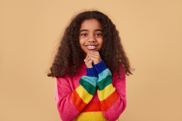 Excited ethnic girl making wish