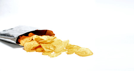 Fried potatoes chips on white background