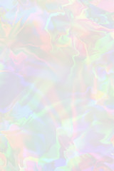 Pastel colored holographic gradient background.