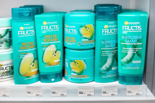 14 March 2020, Ufa, Russia: Shampoos balms and other cosmetic products of Garnier Fructis company on the counter of a household chemicals store