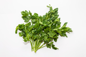 green bunch of parsley on a white background close up
