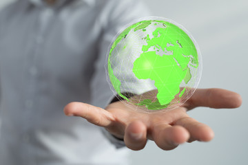 Human Hand Holding The World In Hands.