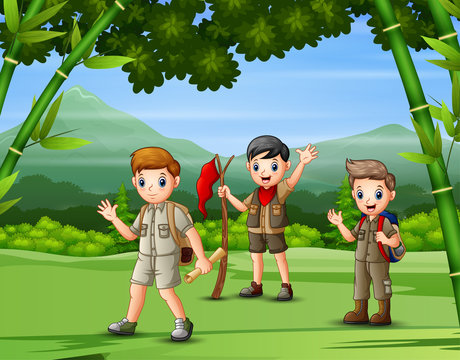 A group of scouts hiking in the forest