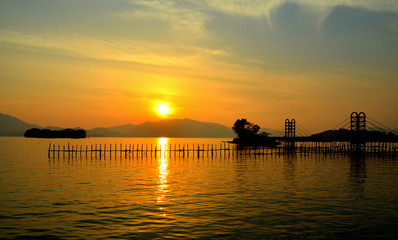 Naklejka na ściany i meble Sunset in Namhaedo or Namhae Island on the southern coast of South Gyeongsang Province, South Korea.