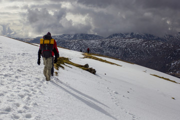 walking in the snow on a mountain