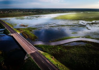 After the rain, an aerial shot of Kgomo Kgomo Bridge, South Africa, with rivers changing as the...