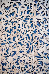 carved wooden pattern on a blue treasure as interior decoration