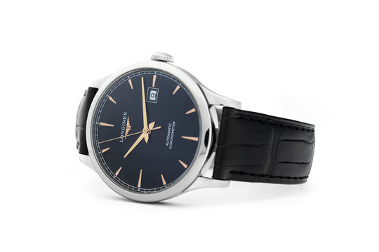 Saint-Imier, Switzerland, 2.02.2020 - Longines luxury watch automatic chronograph with black watch face leather strap isolated white table background