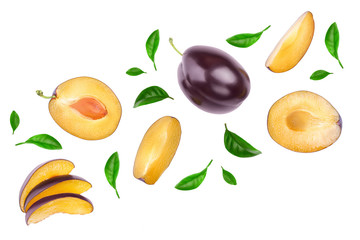 fresh purple plum and half isolated on white background with clipping path and copy spase for your text. Top view. Flat lay