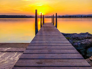 wooden pier at sunset