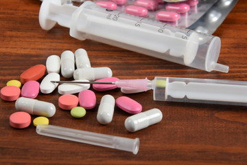 syringe and blister with tablets