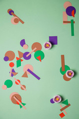 abstract color figures on green background 