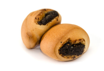 Two small buns with poppy seeds isolated on a white background. Delicious homemade food.