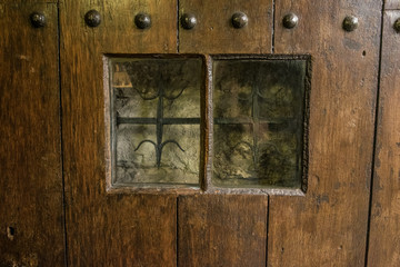 Window in very old door in London