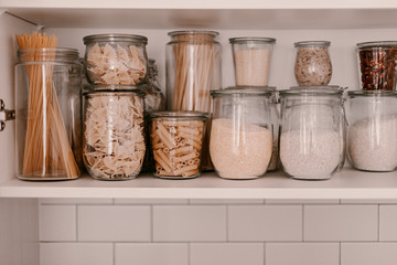 Kitchen storage organization. Zero waste, plastic free. Pasta, grains in glass jars. Organic food....