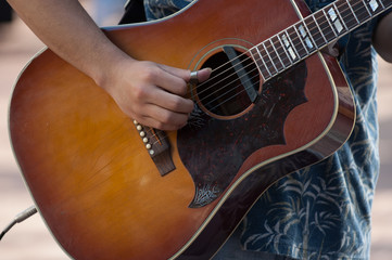 Street musician playing guitar