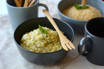 Italian risotto with asparagus in the terracotta bowl