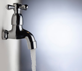 Drain water from the Metal tap, Water flowing from modern faucet