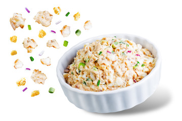 Canned Tuna red onion egg salad on a white isolated background