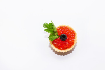 red caviar in tartlets close up on a white background