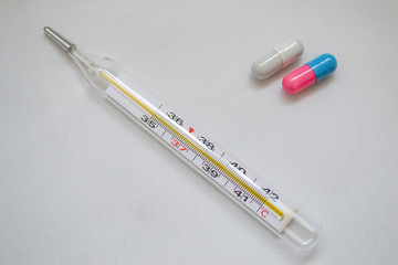 medical thermometer and pills