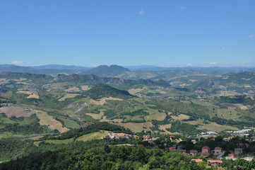 Fototapeta na wymiar Tuscany hills. rolling hills with grass fields and meadows.
