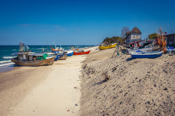 Fototapeta na wymiar Fishing boats on the beach in Chlopy, small village on the Baltic Sea coast, Poland