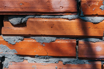 red brick wall with cement